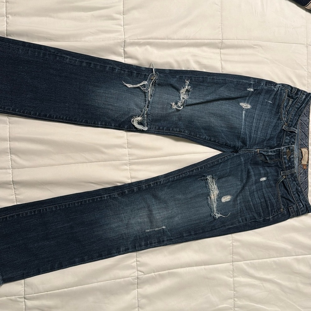 Low rise, wide-legged, ripped Paige Denim jeans, size 25